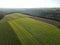 Aerial view of mowed and harvested agriculture fields in the countryside