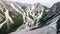 Aerial view of the mudflow with snow high in the Alpine mountains