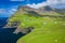 Aerial view of Mulafossur waterfall in Gasadalur village in Faroe Islands, North Atlantic Ocean. Photo made by drone from above.