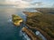 Aerial view of Mutton Bird Island arches and Elephant rock at sunrise