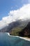 An aerial view of the Napali Coastline\\\'s sandy beach, towering cliffs and verdant valley and the Pacific Ocean in Kauai