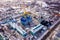 Aerial view of the Nativity-Bogoroditsky monastery surrounded by residential buildings in Zadonsk