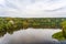 Aerial View of Neman or Nemunas River Surrounded by Autumn Forest in Druskininkai, Lithuania