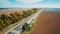 Aerial view of the new road, autumn trees and blue sky