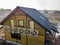 Aerial view of new wooden ecological traditional house cottage of natural lumber materials with steep shingle roof under