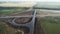 Aerial view of the newly built traffic intersection. Transport interchange of highways. A road under construction in the