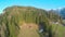 Aerial view of nice wooden hut on farm in mountains, green tourism, ecology