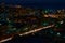 Aerial view of the night city of Vladivostok, Russia. Car traffic.