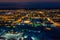 Aerial view of night city in winter. Movement of cars on lighted streets and intersections