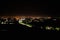 Aerial view of night town from Hill after sunset - modern city with spectacular nightscape panorama. aerial view, night city with