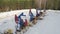 Aerial View Nodding donkey pumps against in winter forest