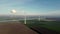 Aerial view of non-running wind turbines in a Dutch landscape.