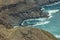 Aerial view of northeast of La Gomera Island. Beautiful rocky ocean coast with breaking waves. Playa De Caleta, La Gomera, Canary