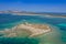 Aerial view of nuraghe in a island in Mediterranean sea next to Sardinia coast