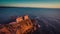 Aerial view of ocean and Nazare lighthouse at sunset, Portugal