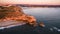 Aerial view of ocean and Nazare lighthouse at sunset, Portugal