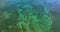 Aerial view of ocean surface and underwater coral reef near Miami, Florida