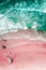 Aerial View Of Ocean Waves And Beautiful Pink Sandy Beach