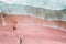 Aerial View Of Ocean Waves And Beautiful Pink Sandy Beach