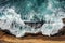 Aerial view of ocean waves on cliff