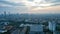 Aerial view of office buildings in Jakarta central business district and noise cloud when sunrise. Jakarta, Indonesia, May 6, 2022