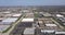 Aerial view of an office park with low-rise buildings near a highway in a suburban setting