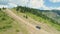 Aerial view of offroade climbing mud road offroad in the mountains near Sopot, Bulgaria