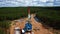 Aerial view oil gas drilling tower in forest