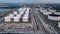 Aerial view oil storage tanks at petrol industrial zone, Refinery factory crude oil storage tank and pipeline steel
