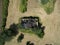 Aerial view of an old abandoned and destroyed farmhouse