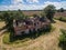 Aerial view of an old abandoned and destroyed farmhouse