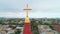 Aerial view of the old city and Christian cross on top of the spire of Odessa Lutheran St. Paul`s Cathedral