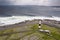 Aerial view on old lighthouse of Inisheer, Aran island, county Galway, Ireland. Irish landscape with rough stone coast line and