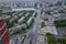 Aerial view of old and new russian buildings near the crossed road in the city with a lot of cars. Russian streets, Novosibirsk,