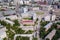 Aerial view of old and new russian buildings near the roundabout in the city with a lot of cars. Russian streets, Novosibirsk,