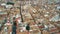 Aerial view of old tiled sloping roofs and narrow streets in Granada centre, Spain