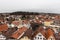 Aerial view of the old town of Fussen on a cloudy winter day from the Hohes Schloss castle, with the Forggensee lake in background