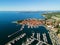 Aerial view of old town Izola in Slovenia, seascape with marina at sunset. Adriatic sea coast, peninsula of Istria, Europe