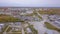 Aerial view of one Russian city`s industrial zone, hangars, plants and industrial equipment. Clip. Construction and