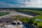 Aerial view of open cast mining panorama quarry with lots of machinery at work equipment at a plant