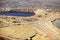 An aerial view of an open pit copper mine.