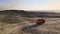 Aerial view of open pit mine of sandstone materials for construction industry with excavators and dump trucks. Heavy