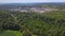 Aerial view of opencast mining quarry with lots of machinery at work in middle of forest on Pennsylvania, USA