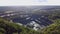 Aerial view of opencast mining quarry in the middle of the forest