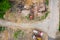 Aerial view, orange excavator with trucks working in demolition site. urban redevelopment