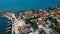 Aerial view of the orange rooftops of the old coast city near the mediterranean sea