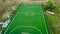 Aerial view of outdoor mini football field located among meadow