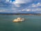 Aerial view over Bourtzi, Venetian water fortress at the entrance of the harbour in Nafplio seaside city in Argolis, Peloponnese,