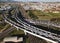 Aerial view over busy interchange at rush hour