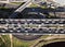 Aerial view over busy interchange at rush hour